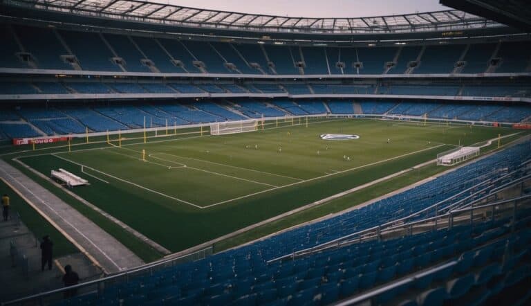 Empty stadium with players wearing masks. Coaches and staff in PPE. No fans in the stands. COVID-19 impact on football